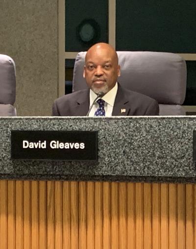 Council Member David Gleaves Seated at Dais