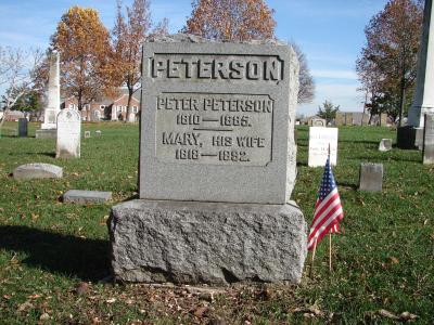 Peterson gravestone monument with american flag